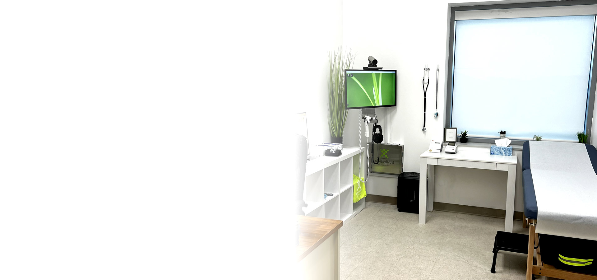 Onsite Medicine At Work clinic where a medic and patient talk with a physician on a telemedicine screen